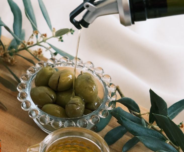 olives and olive on wooden tray